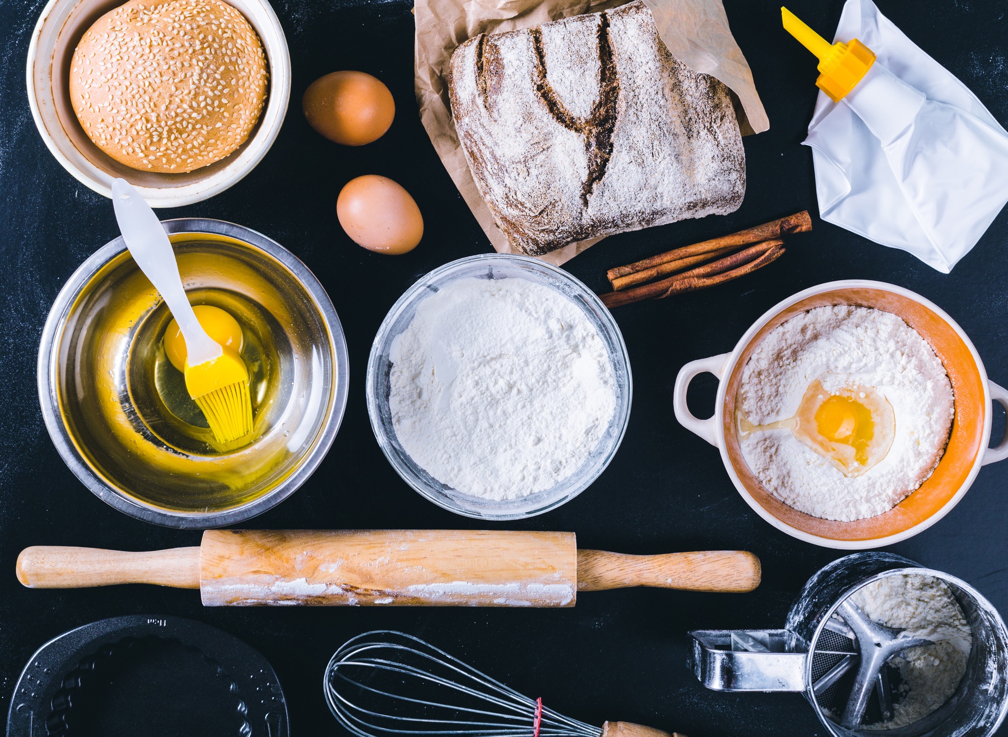 Ingredients and utensil for baking on the black board, top view